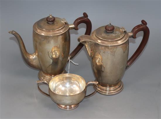 A George VI three piece silver cafe au lait set, Birmingham, 1947, gross 34 oz.